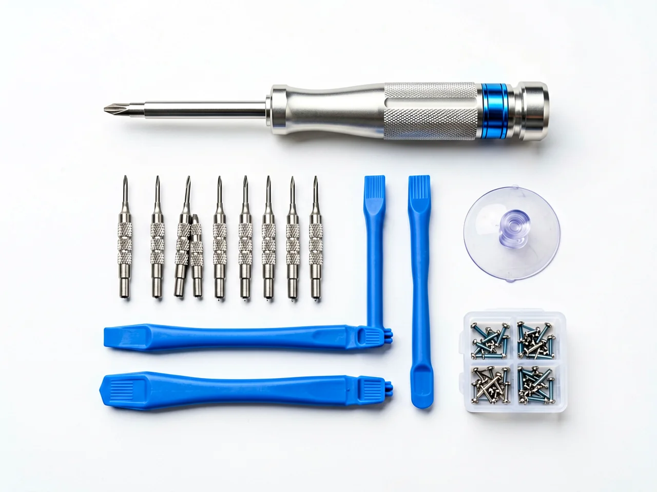 Knolling flat lay of a precision screwdriver set for phone repair: aluminium handle with blue ring, precision bits, pry tools, suction cup and a screw organizer tray